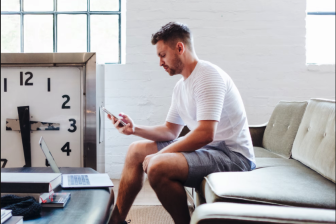 Sitting man with mobile phone